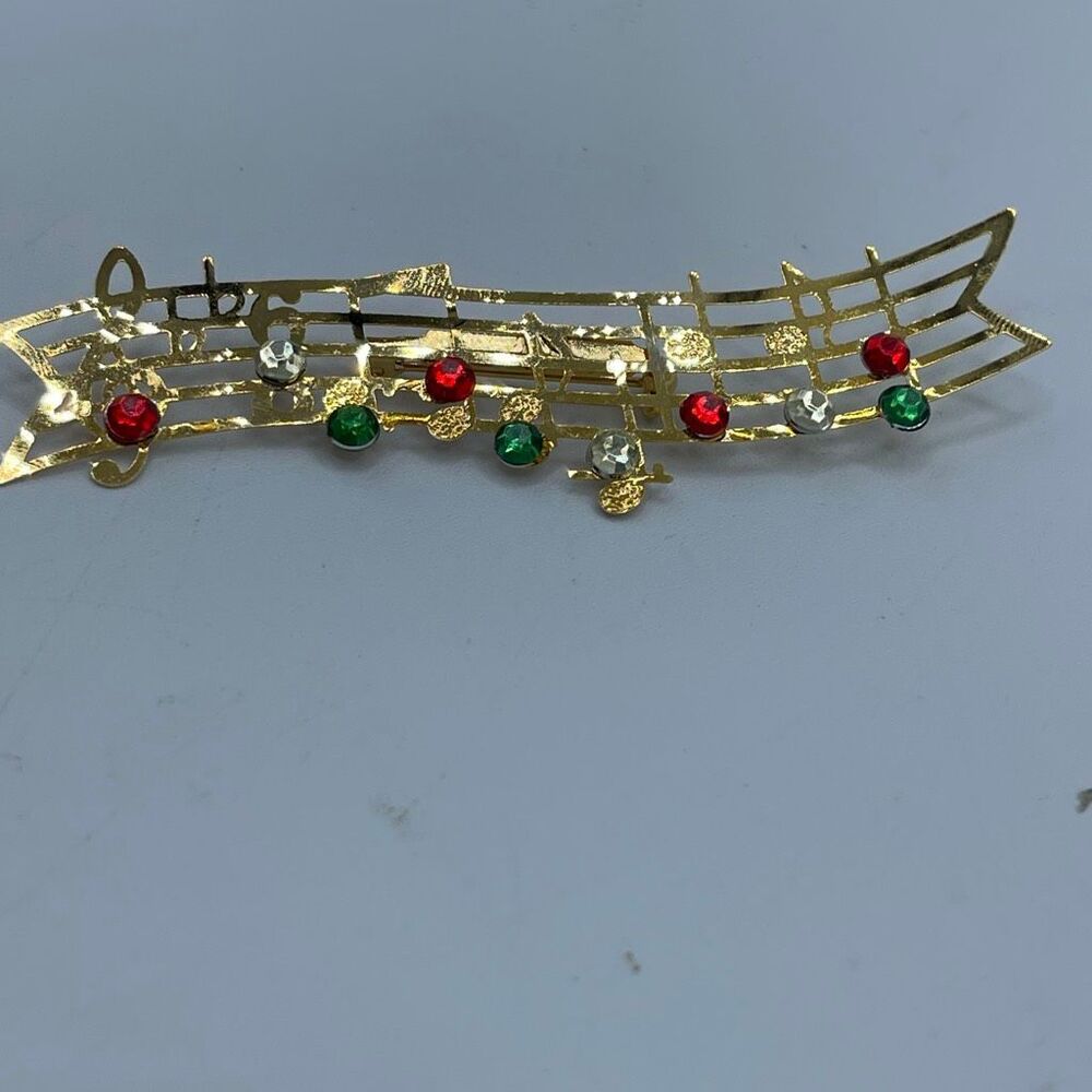 Vintage 3.5β musical ribbon brooch.